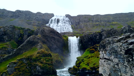 Stunning-Dynjandi-Waterfall-in-Iceland's-west-fjords,-push-in-to-lower-falls-in-the-rain-4k-ProRezHQ