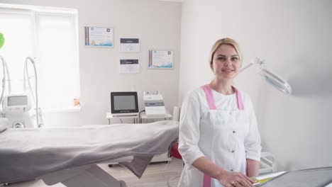 cosmetologist smoothes wrinkles with microcurrent. hardware procedure in cosmetology. peeling, phonophoresis, massage and facelift in a beauty clinic.