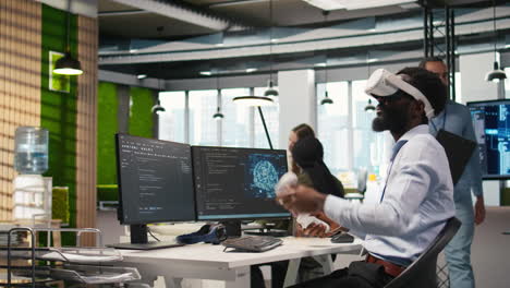 Programmer Wearing Vr Headset At Office Desk Developing Programs Using Ai