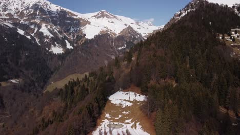 Breathtaking-aerial-view-of-Alps-mountain-range-with-Cattedrale-Vegetale-trees