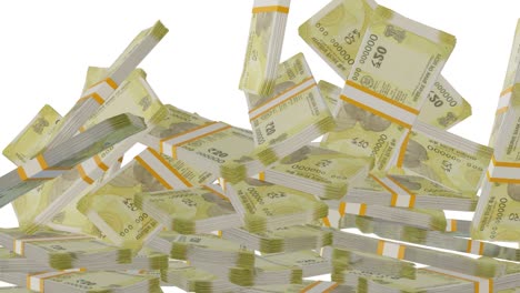 many wads of money falling on table. 20 indian rupees banknotes.
