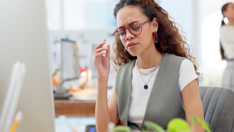 Headache,-burnout-and-young-woman-in-the-office