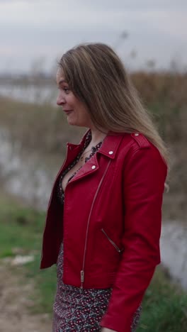 woman in red leather jacket outdoors