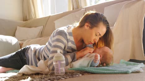 Mother-playing-with-her-baby-boy-in-living-room-4k