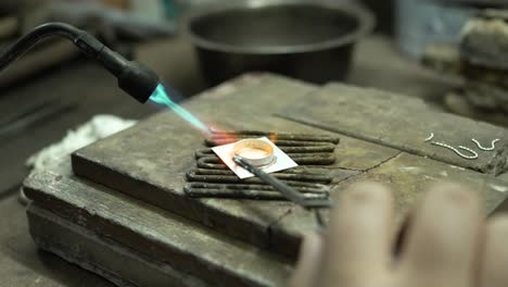 jeweler at work in jewelry. desktop for craft jewelry making with professional tools. close up view of tools. thailand.