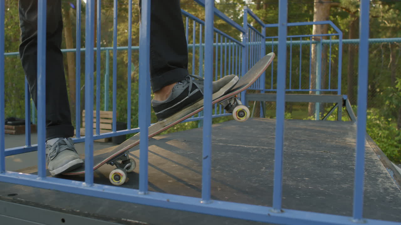 Unrecognizable Young Man on Skateboard