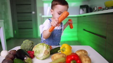 child engaged in colorful vegetable play. a young child plays with vibrant vegetables, showing creativity in a modern kitchen setting during daytime