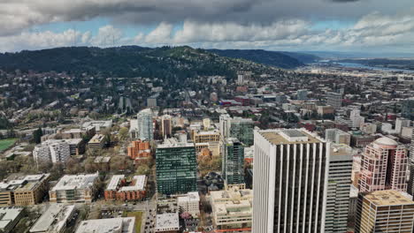 Portland-Oregon-Aerial-v102-flyover-downtown-capturing-urban-cityscape-with-views-of-NW-and-SW-hillside-neighborhoods-and-thick-stormy-clouds-covering-the-sky---Shot-with-Mavic-3-Cine---August-2022