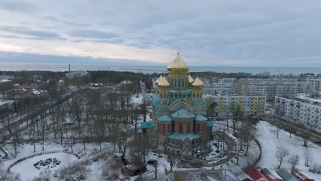 aerial establishing view of orthodox , wide drone shot moving forward