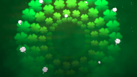 flying green shamrocks with glitters in night sky