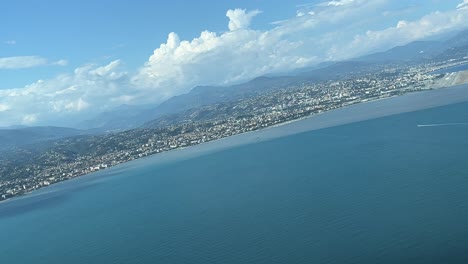 unique panoramic view of the french riviera arriving to nice airport, recorded from an airplane cabin at 1000m high