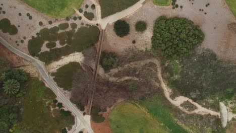 Midday-drone-view-above-the-Pales-Verdes-Estates-golf-club,-California