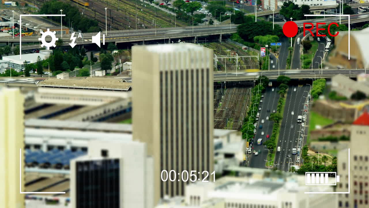 Recording animation over cityscape with buildings, roads, and traffic