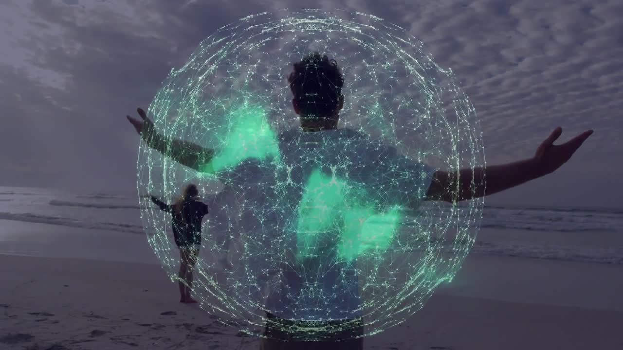 Vídeo vertical: Homem de pé com camiseta branca na praia, globo digital aparecendo e se transformando em asas.