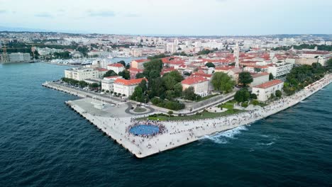 aerial over the zadar sunset monument sea coast, also known as the monument to the sun, is a captivating and innovative art installation located in the beautiful croatian city of zadar