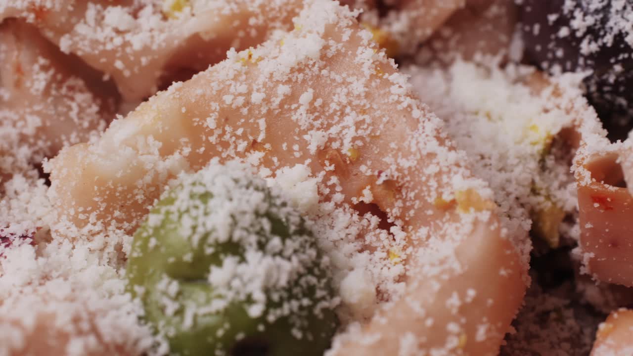 Ham italian mordatella, man Slices Of Traditional Italian antipasti mortadella sausage on a wooden cutting board, close up macro of chicken or turkey jamon, fat breakfast dish.