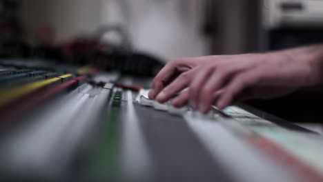 Sound engineer working on mixing console