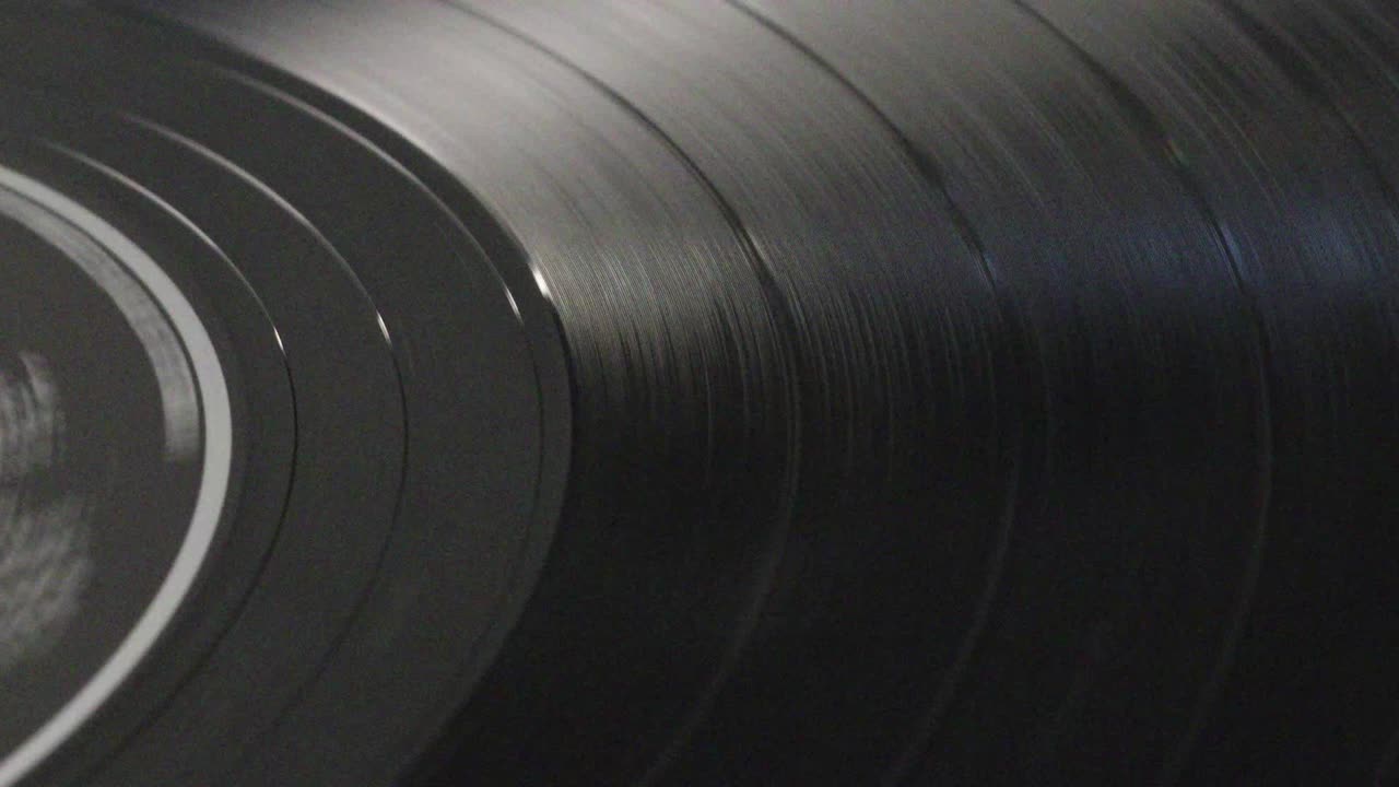 Long play vinyl record rotating on a turntable