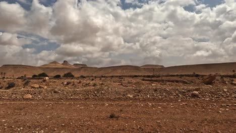 Driving-along-desert-road-to-Ksar-Guermessa-troglodyte-village-in-Tunisia-on-cloudy-day