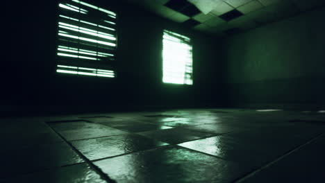 a dark and empty prison cell with barred windows