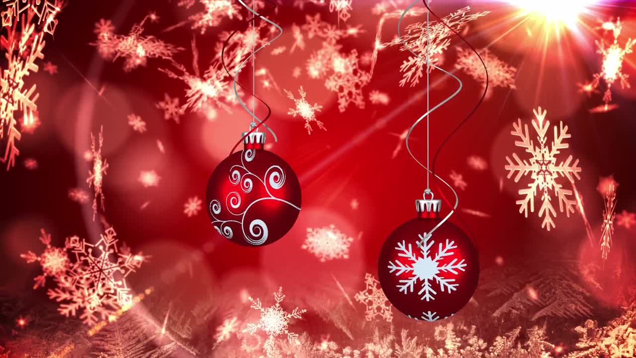 animación de dos adornos de navidad rojos y copos de nieve cayendo sobre un fondo rojo