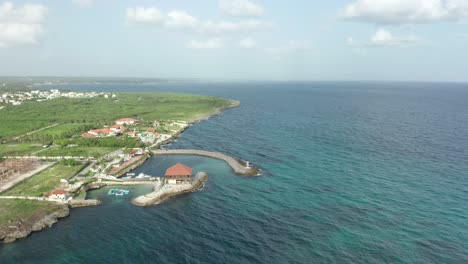 Flying-over-the-deep-blue-waters-with-a-beautiful-horizon-and-a-blue-sky-with-beautiful-clouds-an-impressive-landscape