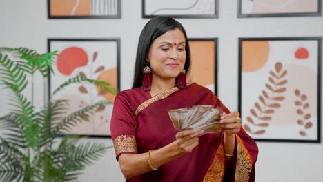 indian woman playing with money