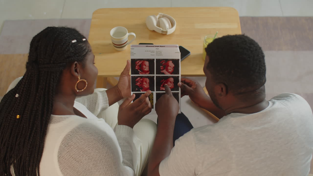 Couple Looking at Ultrasound Report