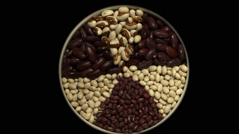 Dry-beans-in-spoke-design-rotate-isolated-on-black-background