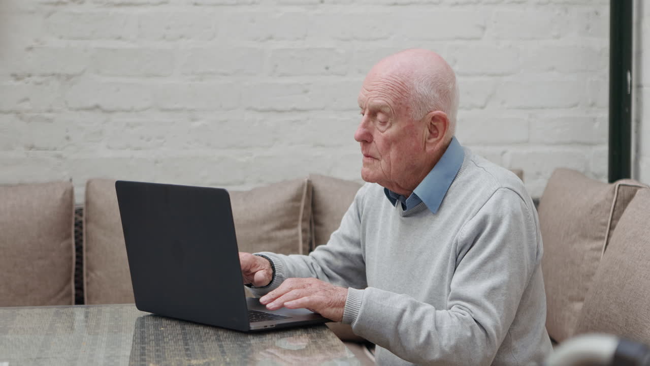 Elderly Man Using Laptop