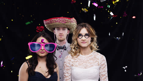 serious group of people in confetti shower slow motion party photo booth