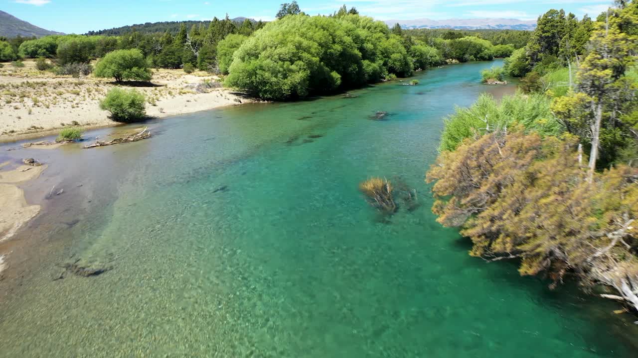 Lake and River Cholila, Patagonia, Argentina, aerial forward flyover wide shot