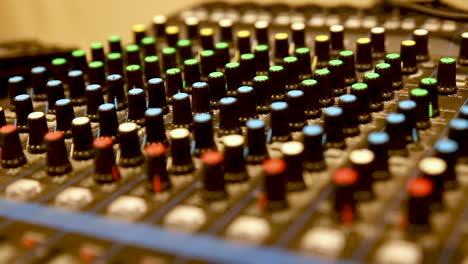 Professional-audio-mixer-with-many-channels,-sideways-movement