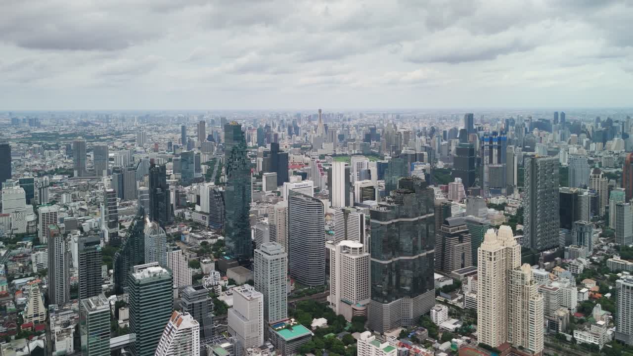 Bangkok Skyline Under Soft Clouds — Moody Aerial Footage of Business District and Urban Texture