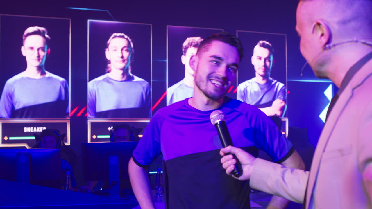 announcer Interviewing Cyber Sportsman during Championship Host with Microphone Asking Questions to Esportsman Male Gamer Esportsman Teammate during Professional Gaming Tournament