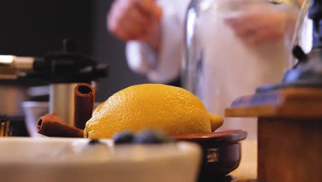 chef picking a lemon from the counter