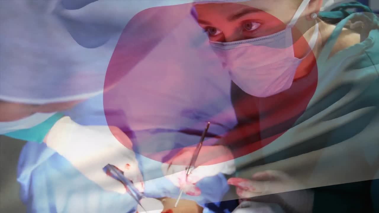 수술실 에서 외과 의사 들 위 에 흔들리는 일본 국기 의 애니메이션