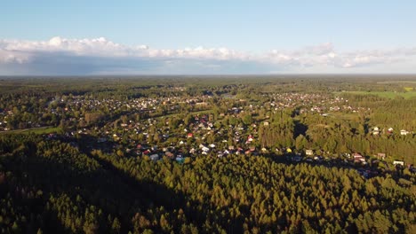 high-angle aerial view of latvian settlement with autumn colors