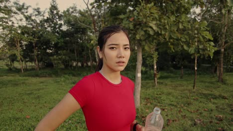 woman taking a break in park after running