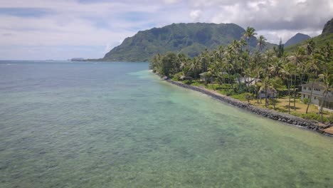 the stone-sand shore of this hawaiian beach harmonizes with the inviting shades of turquoise in the sea