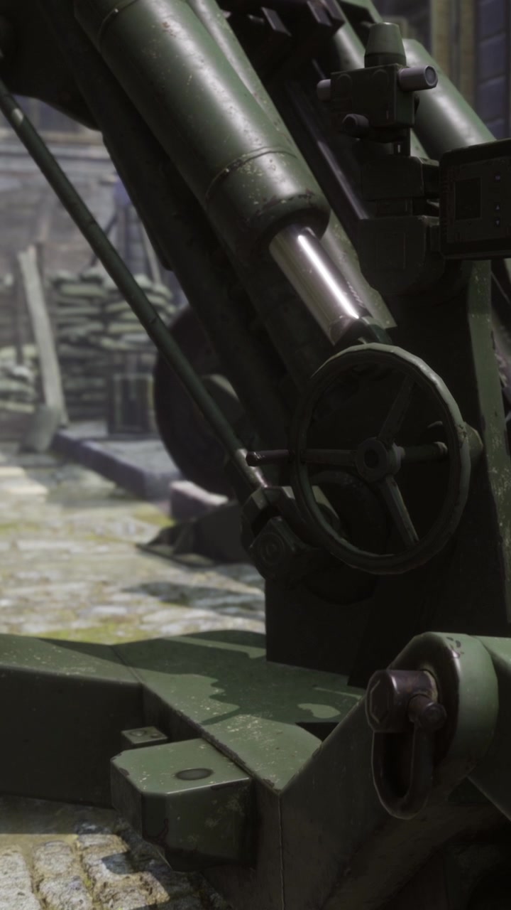 A large artillery piece stands on a rocky surface