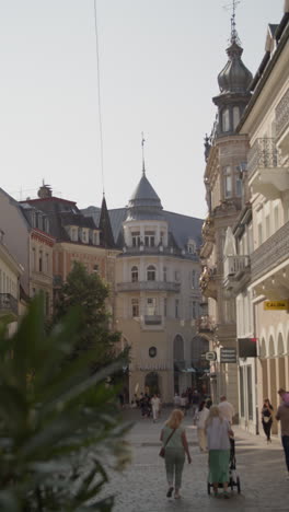 walking down a busy street in a european city