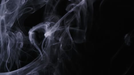 real white smoke moves on black background