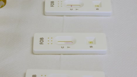 traveling purple line on rapid test for fecal blood in human stool analysis in medical laboratory