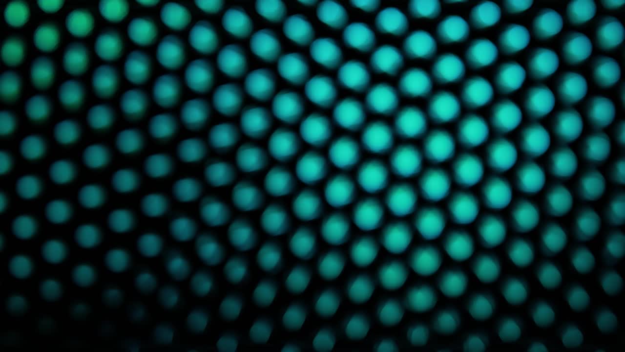 Seamless loop with beautiful colorful bokeh changing shapes on neon lights creating glowing background in motion
