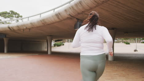 young caucasian woman running