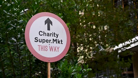 This-way-to-the-Charity-Super-MKt,-London,-United-Kingdom