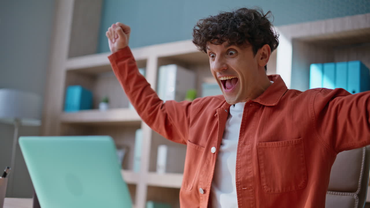 Successful freelancer feeling happy working on project in workplace closeup