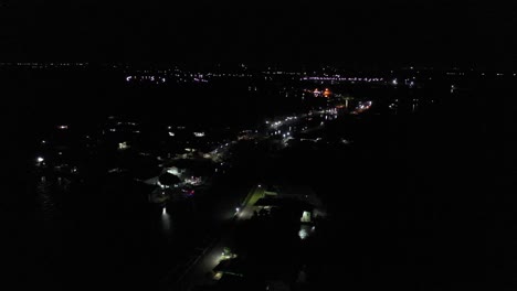 night aerial view of a city by a river
