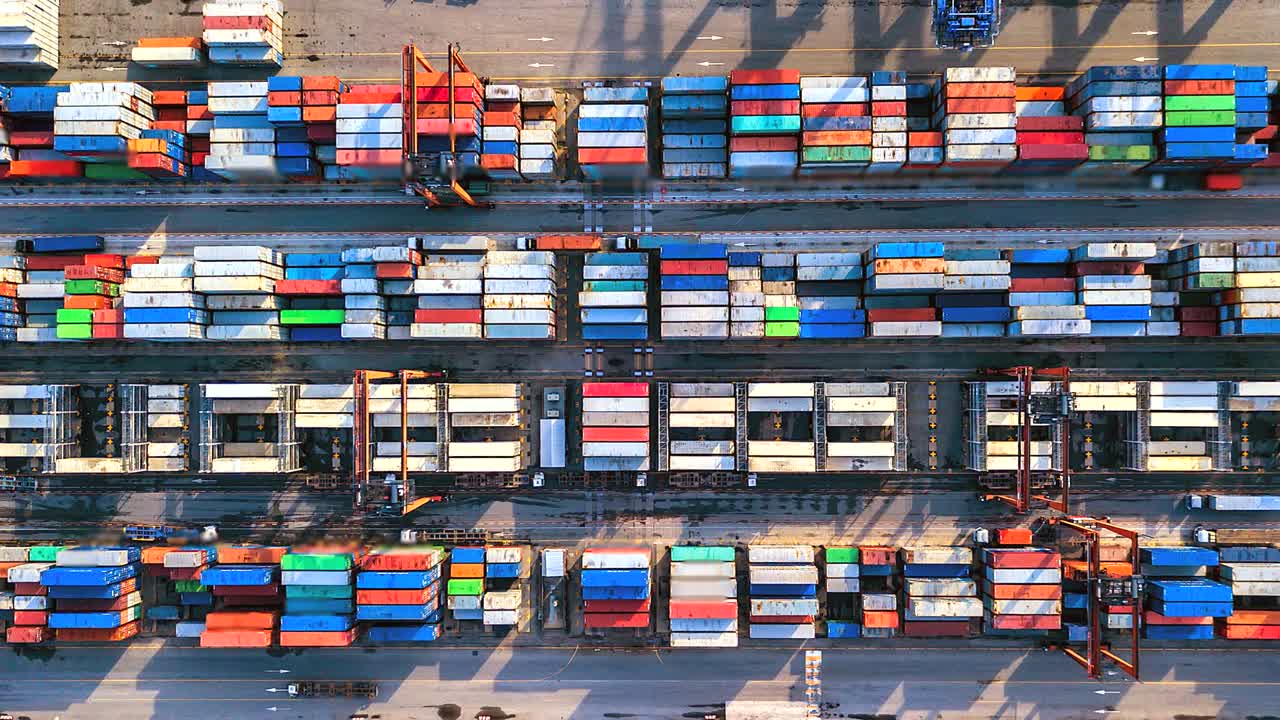 Aerial view, 4K.Time lapse Industrial port with Container port where is a part of shipping